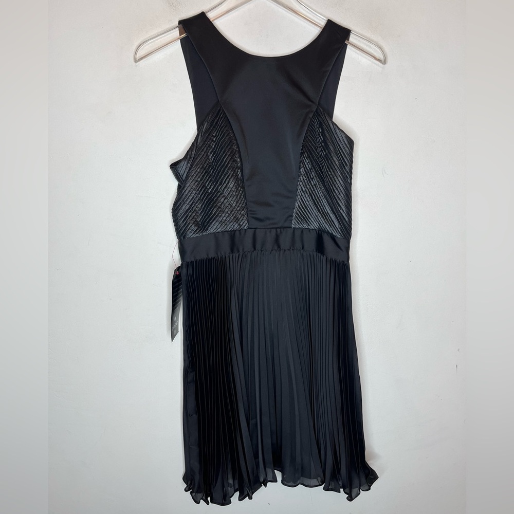 BEBE  Black Mix Fabric Pleat Skirt Cocktail Dress. New With Tags. Size 4